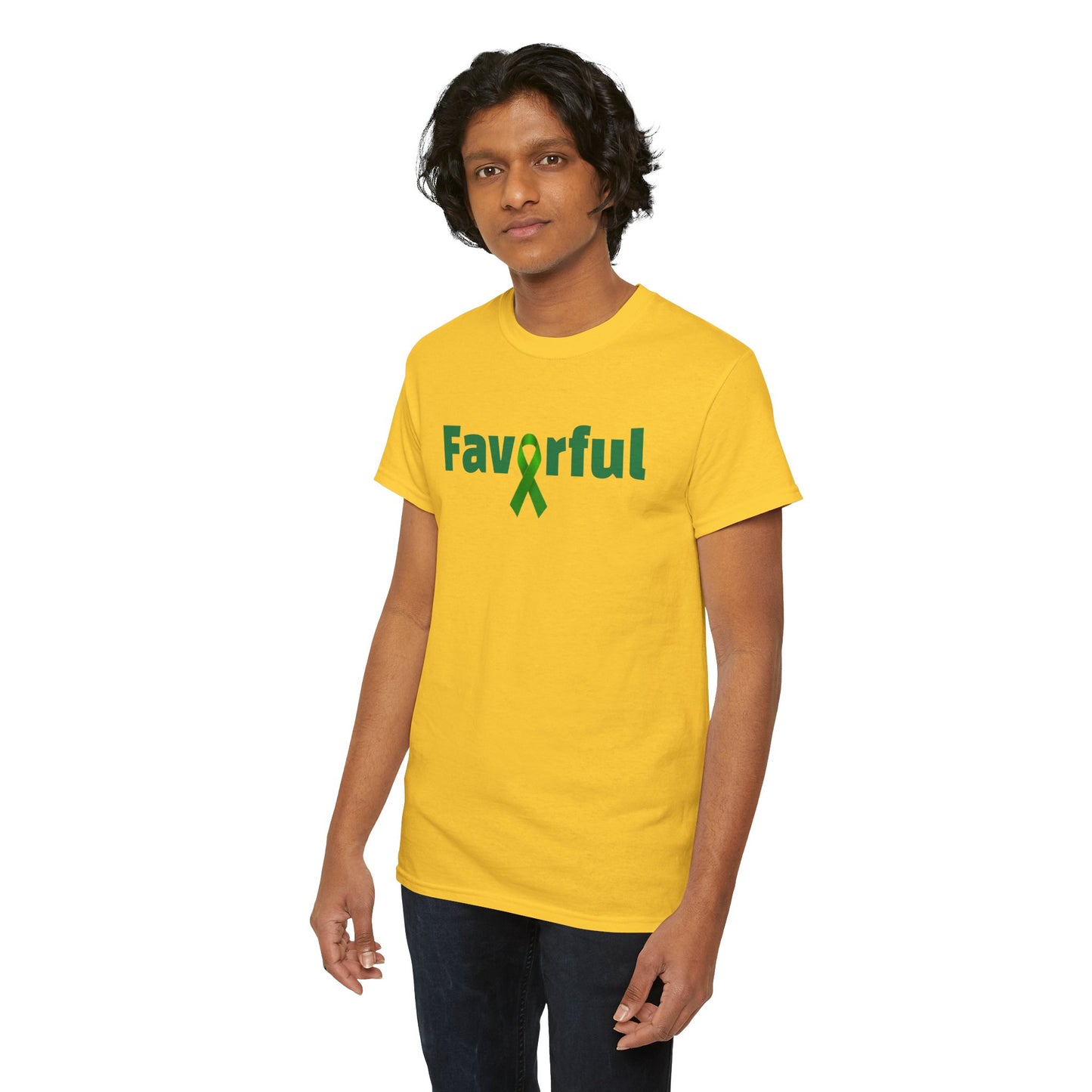 A person wears a bright yellow t-shirt with the word “Favorful” printed across the chest in green letters. The letter “v” is stylized as a green awareness ribbon, blending typography with symbolism. The design radiates positivity and advocacy, suggesting that favor and support go hand in hand with mental health awareness. The person stands against a plain white background, allowing the shirt’s message to take center stage.