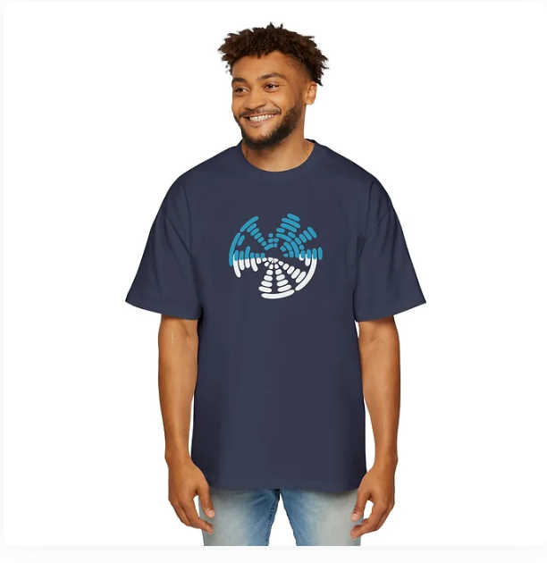 A person wears a navy blue t-shirt featuring a circular graphic design composed of segmented white and blue bars arranged in a dynamic, swirling pattern. The design evokes motion, rhythm, and quiet intensity, blending modern aesthetics with symbolic resonance. The shirt’s bold visual energy makes it ideal for campaigns centered on emotional frequency, inner strength, or expressive identity.