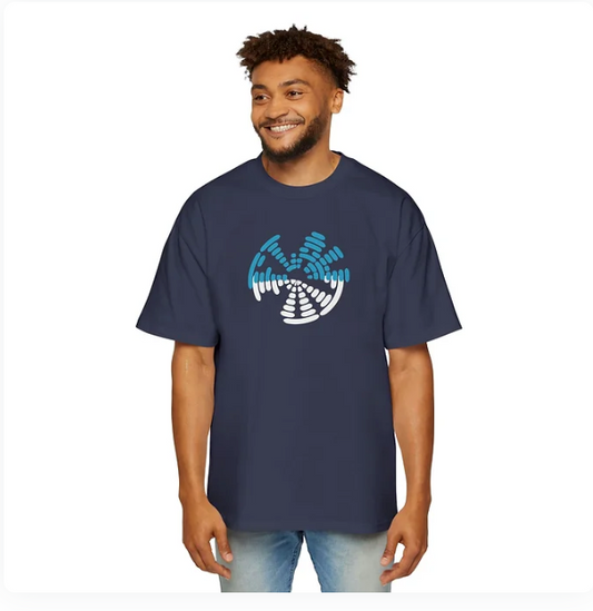 A person wears a navy blue t-shirt featuring a circular graphic design composed of segmented white and blue bars arranged in a dynamic, swirling pattern. The design evokes motion, rhythm, and quiet intensity, blending modern aesthetics with symbolic resonance. The shirt’s bold visual energy makes it ideal for campaigns centered on emotional frequency, inner strength, or expressive identity.