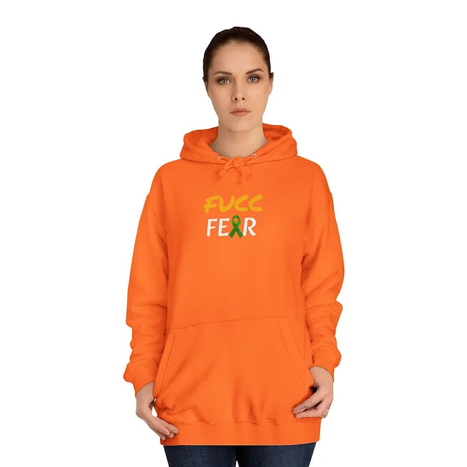 A person wears an orange hoodie with the bold phrase “FUCC FEAR” printed across the chest. The word “FUCC” is in yellow, while “FEAR” is in white, with the letter “A” replaced by a green awareness ribbon. The hoodie features a front pocket and drawstring hood. The design delivers a defiant message of courage and advocacy, blending bold typography with symbolic support for mental health or related causes.