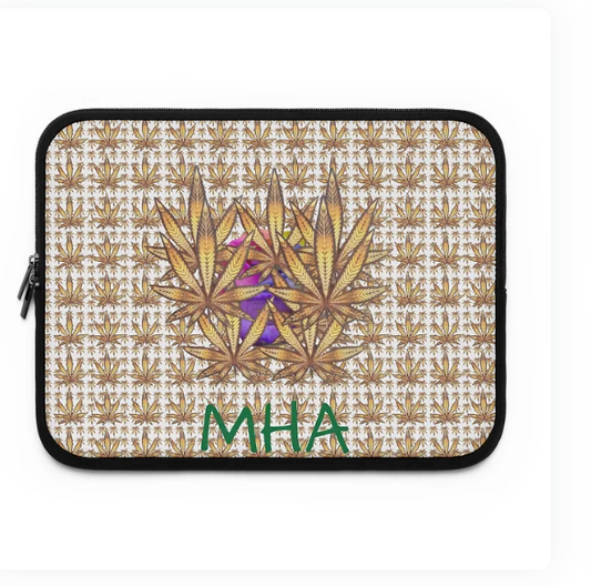 A laptop sleeve features a bold and artistic design with a repeating pattern of stylized cannabis leaves in shades of brown and gold. At the center, a cluster of larger leaves is overlaid with a vibrant abstract motif in purple and pink. Beneath this central graphic, the letters "MHA" are prominently displayed in green. The sleeve blends natural symbolism with expressive color, suggesting a fusion of cultural identity and creative flair.