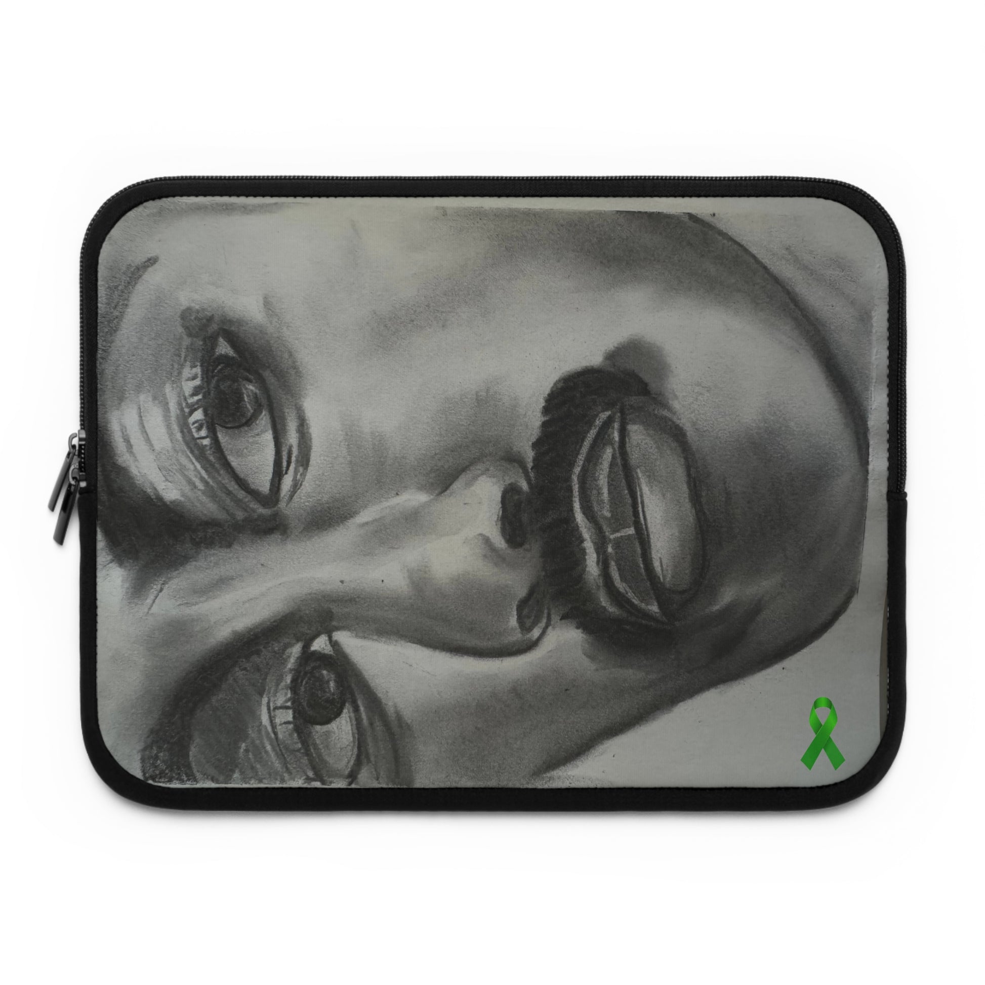 A laptop sleeve features a grayscale, upside-down artistic portrait of a man's face, emphasizing expressive eyes, a defined nose, lips, and a prominent mustache. A small green awareness ribbon appears in the bottom right corner, symbolizing support for causes like mental health. The sleeve includes a zipper on the left side, combining secure functionality with bold, personal expression and advocacy.