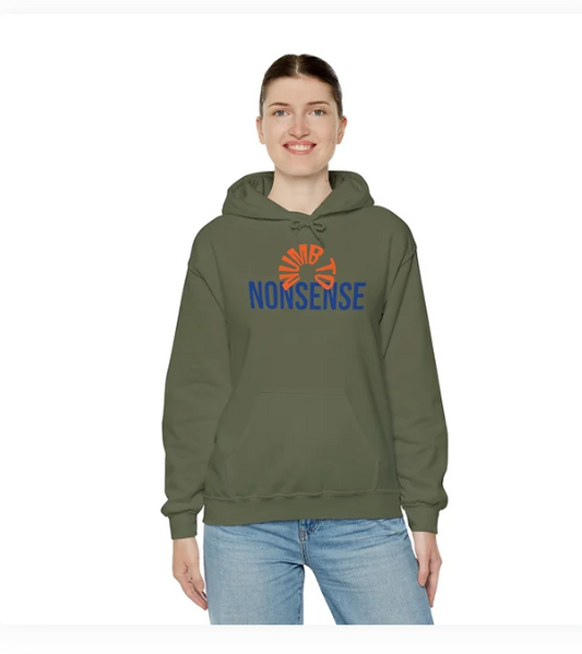 A person wears a green hoodie with a bold graphic design on the front. The word "NONSENSE" is printed in large blue capital letters, while an abstract orange symbol resembling a stylized sunburst or fan sits above it, incorporating the letters "NS" into its shape. The individual is smiling and dressed in light blue jeans, standing against a plain background. The design is playful and eye-catching, blending typography and abstract art to create a statement piece.